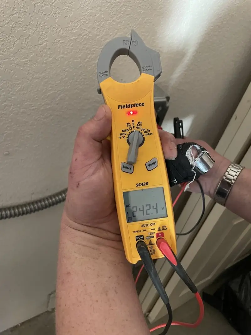 Voltage testing with clamp meter during Ceiling Fan Installation in White Plains